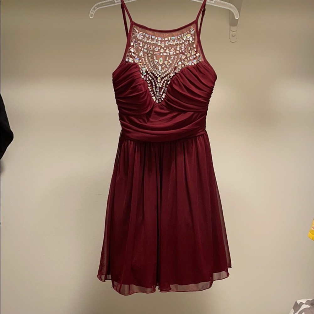 short maroon dress with jews at the top